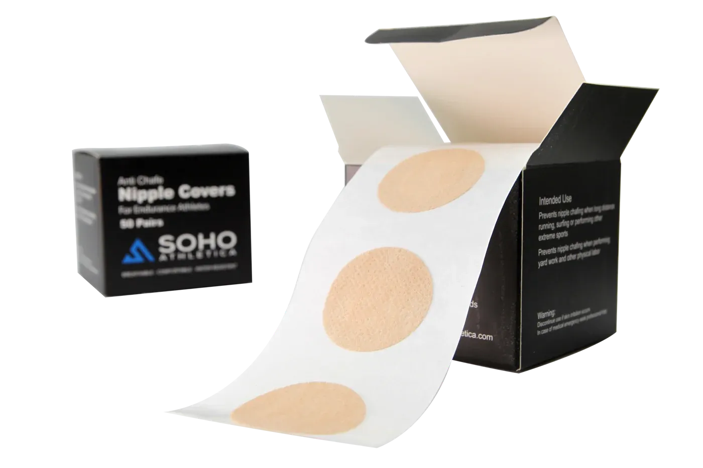 Open box with a strip of round nipple covers on backing film